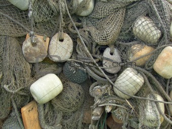 float, stone sinker old fishing nets catch closeup