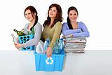 Three young women recycling