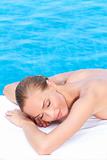 Woman during spa treatment next to pool