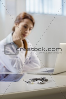 stethoscope on desk in doctor office