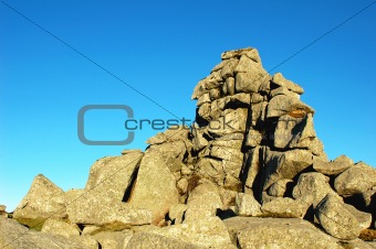 Huge rocks against blue sky