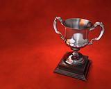 Trophy cup on plinth with red background