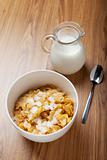 Breakfast cereal with milk and spoon