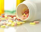 Medicine bottles and pills close up 