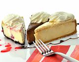 slices of cheesecakes with fork and napkin 