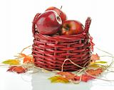 Red apples in wood basket 