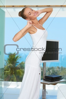 Elegant shapely woman stretching