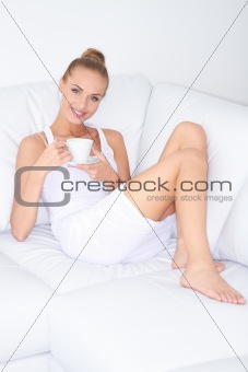 Beautiful elegant woman drinking coffee