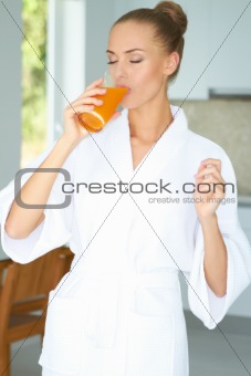 Woman enjoying a glass of orange juice