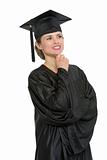 Portrait of thoughtful graduation woman isolated