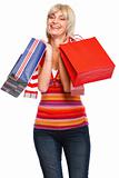 Happy senior woman with shopping bags