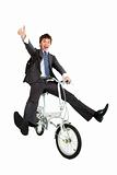 Happy asian  businessman on a bicycle isolated on white backgrou