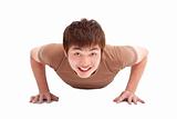 smiling Young man make push-ups  and fitness
