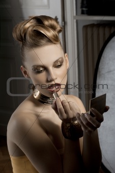 the fashion girl applying lipstick