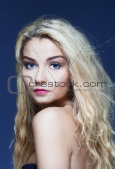 portrait of a young beautiful woman with long blond hair