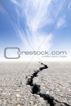 cracked road with cloud background