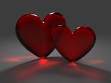 Two red hearts from frosted glass with caustic effect