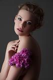 low key girl with purple carnation flower