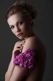 elegant girl portrait with purple carnation flower