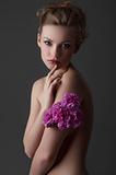attractive girl portrait with purple carnation flower