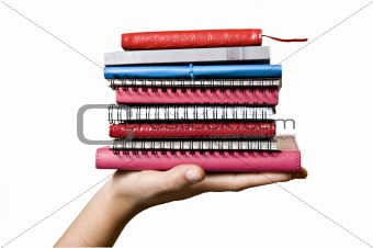Stack of books in hand