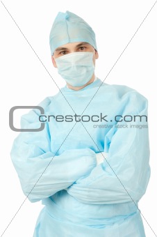 Male surgeon in uniform with arms crossed