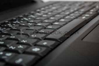 toned background with computer keyboard