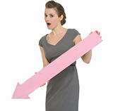 Surprised business woman with big arrow pointing down isolated