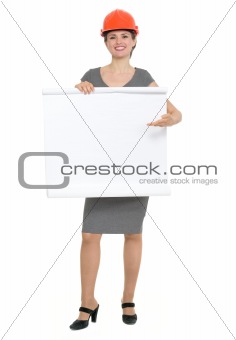 Happy architect woman pointing on blank flip chart isolated