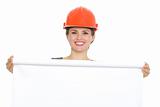 Portrait of smiling architect woman with blank flipchart isolated
