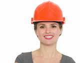 Portrait of smiling architect woman in helmet isolated