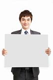 smiling asian business man holding empty board