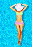 Sexy woman body in the pool 