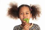 beautiful child  asian African American Black child eats salad i