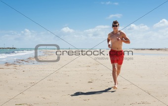 man running along the coast