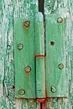 Old hinges on the wooden boards