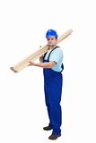 Construction worker carrying wooden plancks