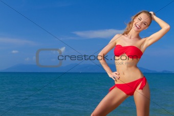 Beautiful smiling woman ,  blue sea and sky
