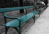 Blue-green bench isolated on black and white background