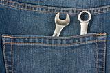 Wrenches in the pocket of jeans