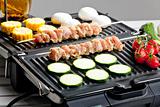 meat skewers and vegetables on electric grill