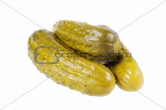 Three pickled  cucumbers.  Gherkins.