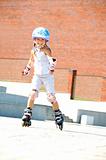 child on inline rollerblade skates