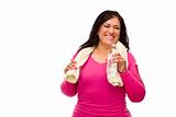 Attractive Middle Aged Hispanic Woman In Workout Clothes with Water Bottle and Towel Against a White Background.