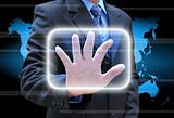 businessman hand pushing button on a touch screen interface