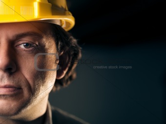 Portrait of adult manual worker with helmet