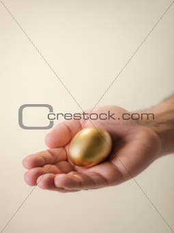 Man showing golden eggs, symbol of money saving