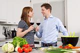 Young couple drinking wine in the kitchen