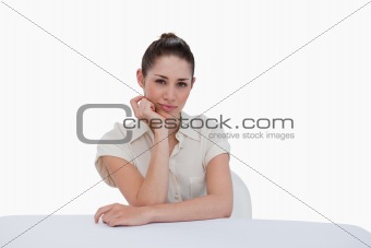 Happy businesswoman sitting