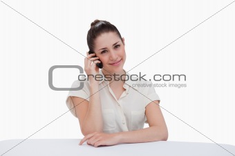 Happy businesswoman making a phone call